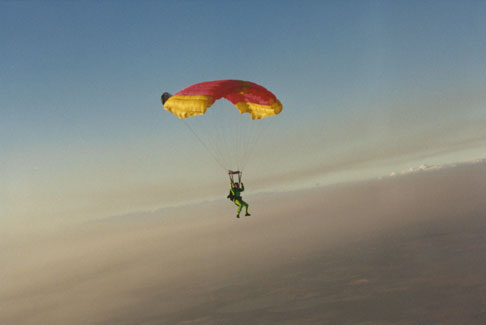 Anthony Martin glides to safety with his parachute